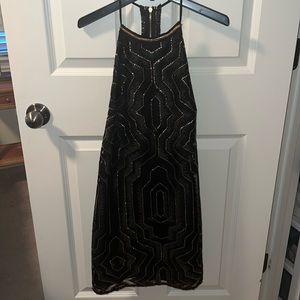 Black and gold sparkling mini dress